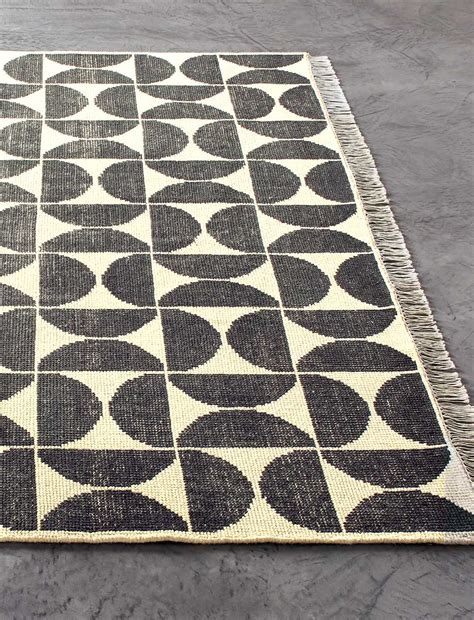Designed by Studio Anansi. . Cb2 rugs